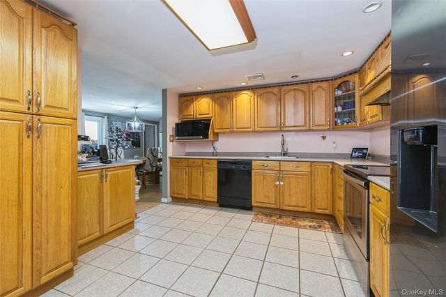 54 College Hills Drive, Farmingville, NY 11738