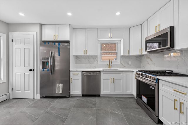 9911 205th Place, Hollis, NY 11423