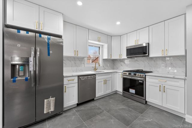 9911 205th Place, Hollis, NY 11423