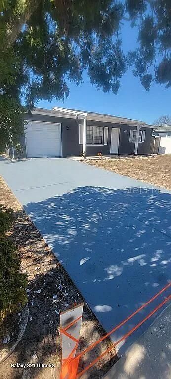 Image 1 of property listing at 9901 WOODSTOCK LANE, Port Richey, FL 34668