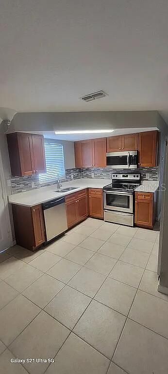 Image 4 of property listing at 9901 WOODSTOCK LANE, Port Richey, FL 34668