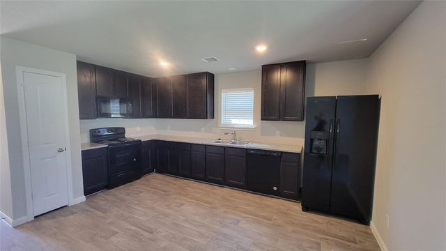 15027 Sorrento Bay Court, Willis, TX 77318