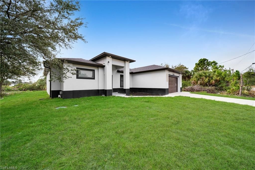 1002 Kanuga ST E, LEHIGH ACRES, FL 33974 — photo 5
