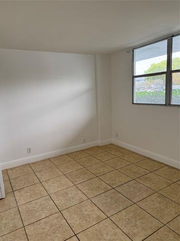 115 ROYAL PARK Drive 1F, Oakland Park, FL 33309