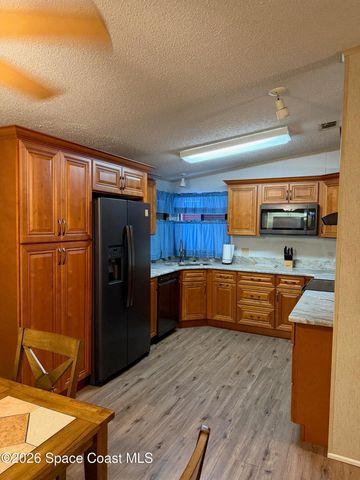 706 Hyacinth Circle, Barefoot Bay, FL 32976