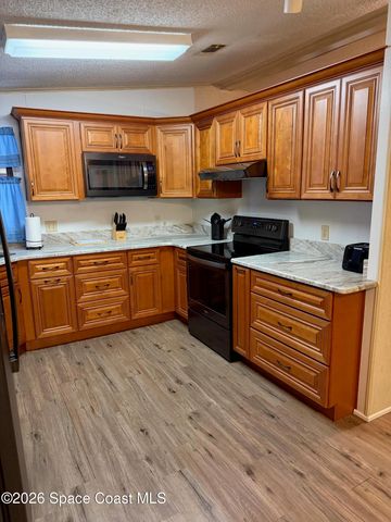 706 Hyacinth Circle, Barefoot Bay, FL 32976