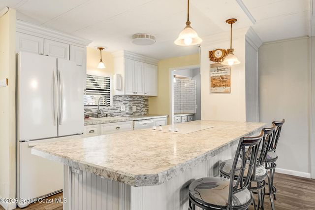 811 Silverthorn Court, Barefoot Bay, FL 32976