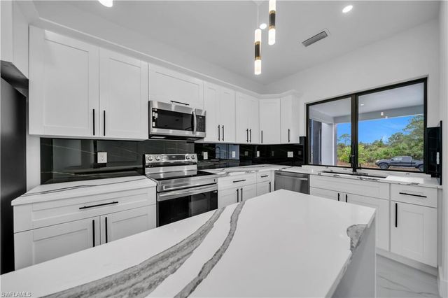 907 E 9th ST, Lehigh Acres, FL 33972