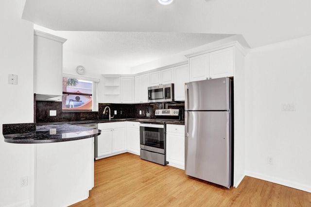 52 Uno Lago Drive, Juno Beach, FL 33408