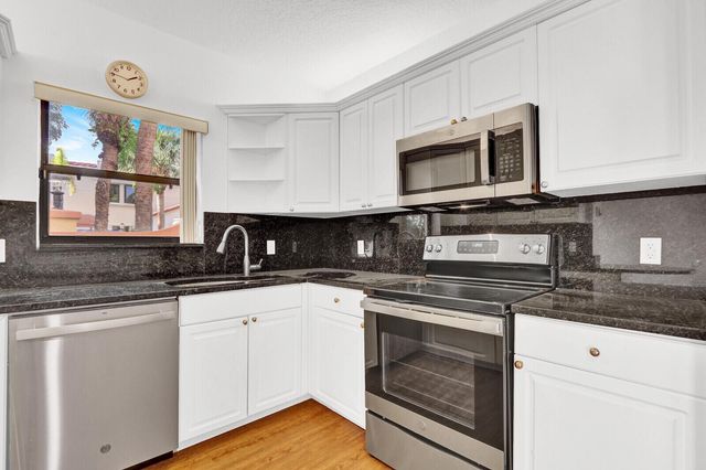 52 Uno Lago Drive, Juno Beach, FL 33408