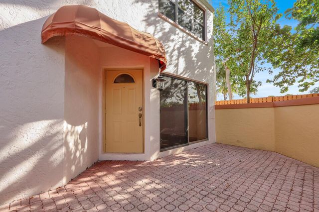 52 Uno Lago Drive, Juno Beach, FL 33408