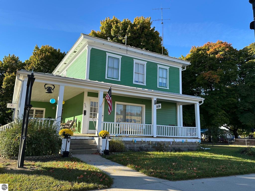 Image 1 of property listing at 323 W Wright Avenue, Shepherd, MI 48883