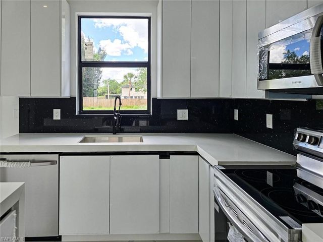 1411 Moore AVE, Lehigh Acres, FL 33972