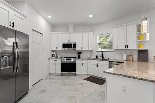 7911 N PACKWOOD AVENUE, Tampa, FL 33604