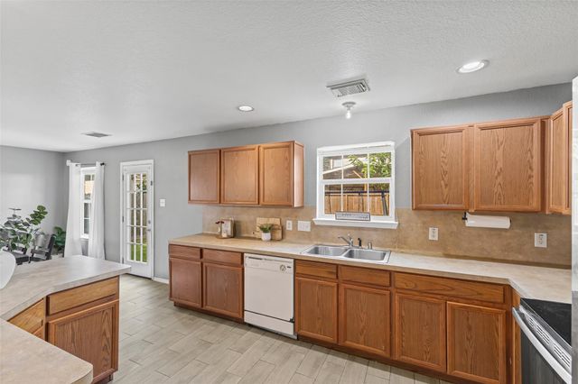 9439 Gnarled Chestnut Court, Houston, TX 77075