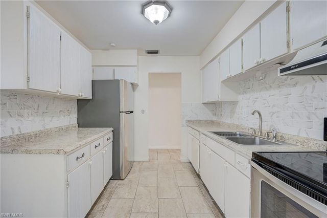 63 Tangelo CT, Lehigh Acres, FL 33936