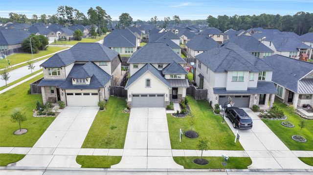 1439 Northwood Bluff Lane, Pinehurst, TX 77362