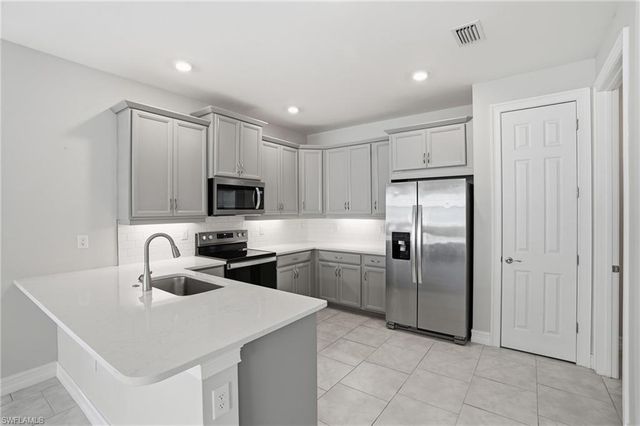 1040 Tranquil Brook DR, Naples, FL 34114