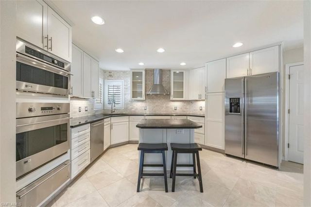 25 Grey Wing PT, Naples, FL 34113