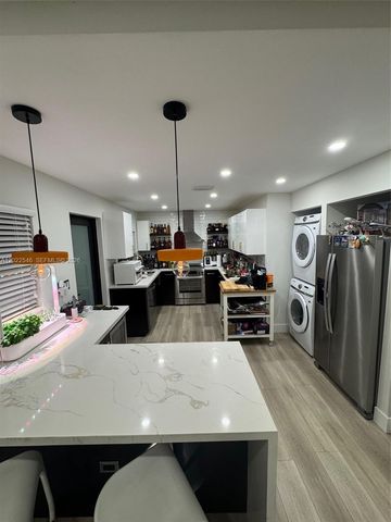 557 NW 44st front, Miami, FL 33127