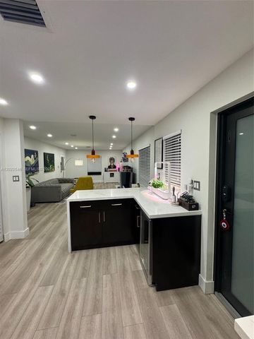 557 NW 44st front, Miami, FL 33127