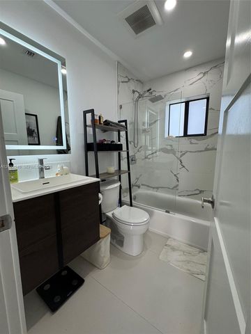 557 NW 44st front, Miami, FL 33127