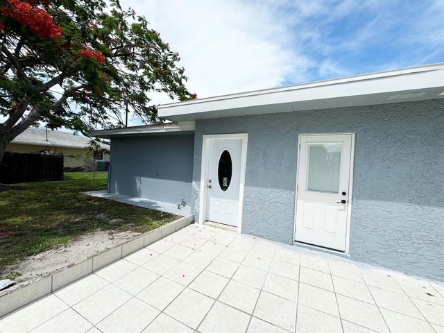 702 NE Lanfair Street, Port St. Lucie, FL 34983