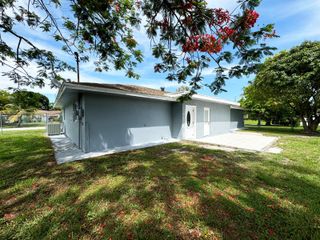 702 NE Lanfair Street, Port St. Lucie, FL 34983