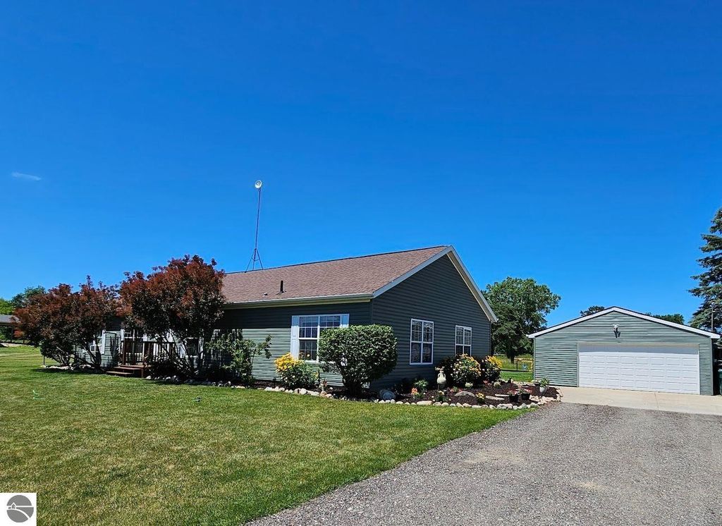 Image 1 of property listing at 5557 E Pleasant Valley Road, Shepherd, MI 48883