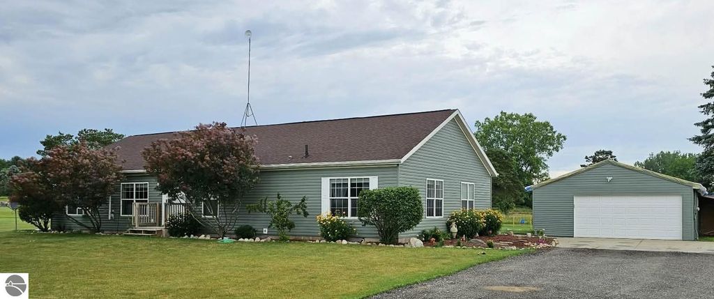 Image 2 of property listing at 5557 E Pleasant Valley Road, Shepherd, MI 48883