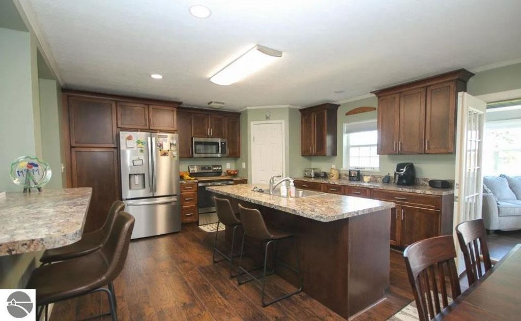 Image 6 of property listing at 5557 E Pleasant Valley Road, Shepherd, MI 48883