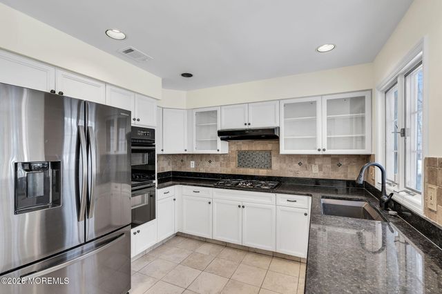 8 Winding Woods Way, Manalapan, NJ 07726