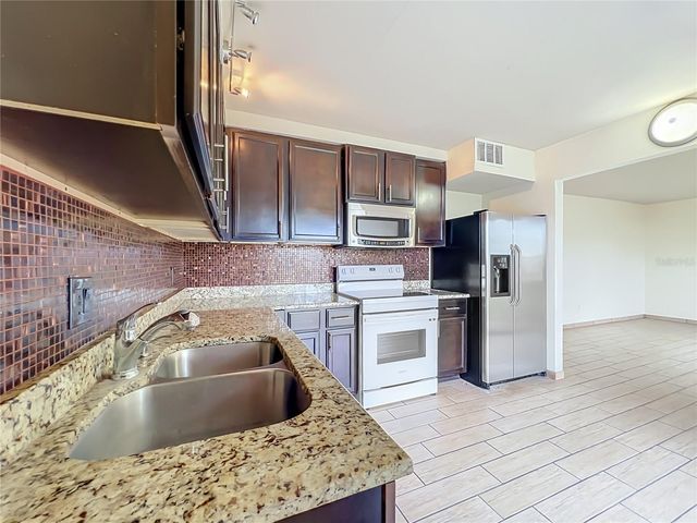 5885 DAHLIA DRIVE 103, Orlando, FL 32807