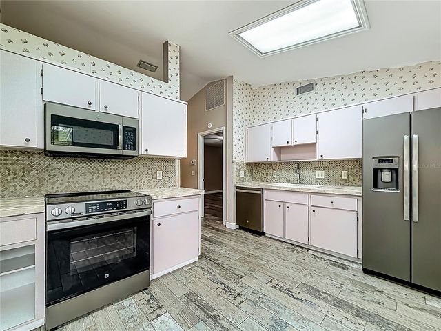 12208 WEDGEFIELD DRIVE, Grand Island, FL 32735