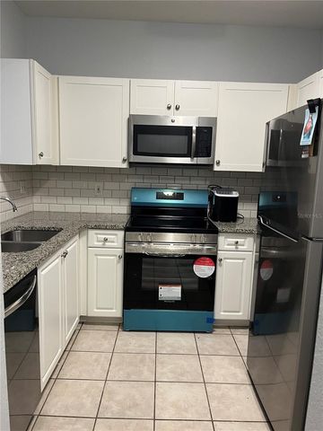 2572 ROBERT TRENT JONES DRIVE 1220, Orlando, FL 32835