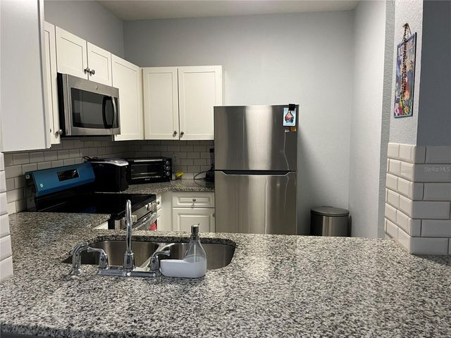 2572 ROBERT TRENT JONES DRIVE 1220, Orlando, FL 32835