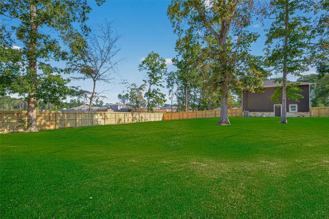 10594 Rustling Oaks Drive, Conroe, TX 77303