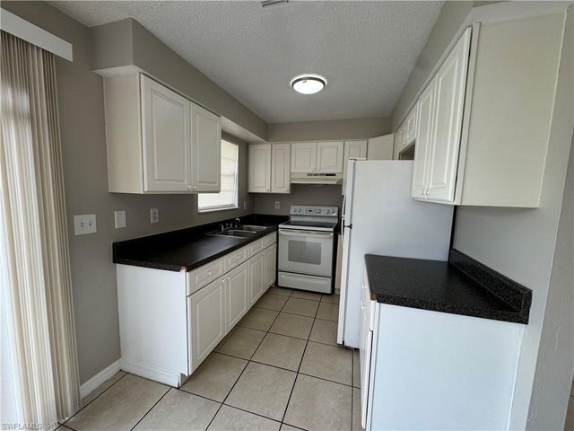 1112 Gifford AVE S, Lehigh Acres, FL 33936