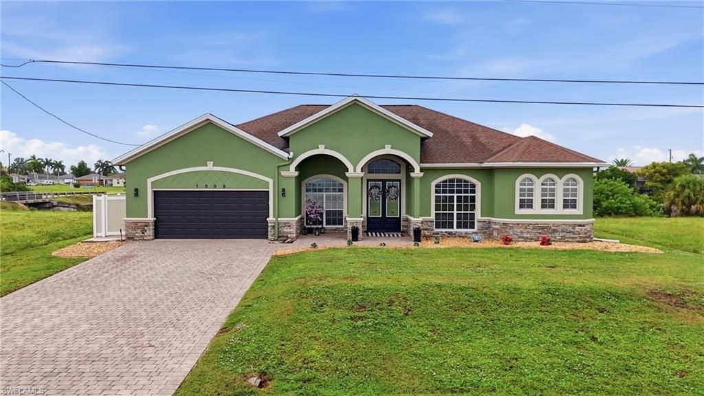 1005 NW 3rd PL, CAPE CORAL, FL 33993 — photo 2