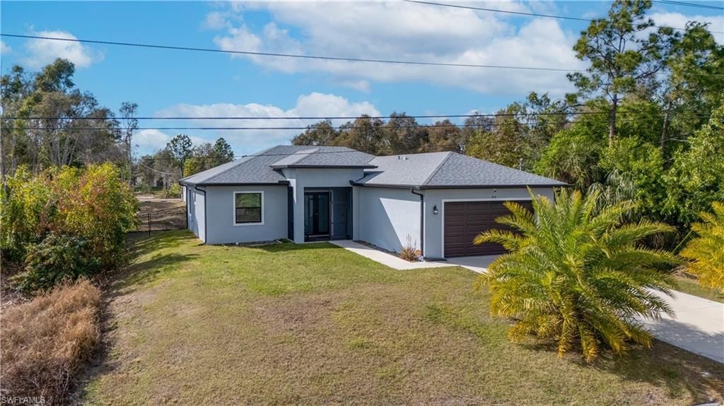 816 Bell BLVD S, LEHIGH ACRES, FL 33974 — exterior