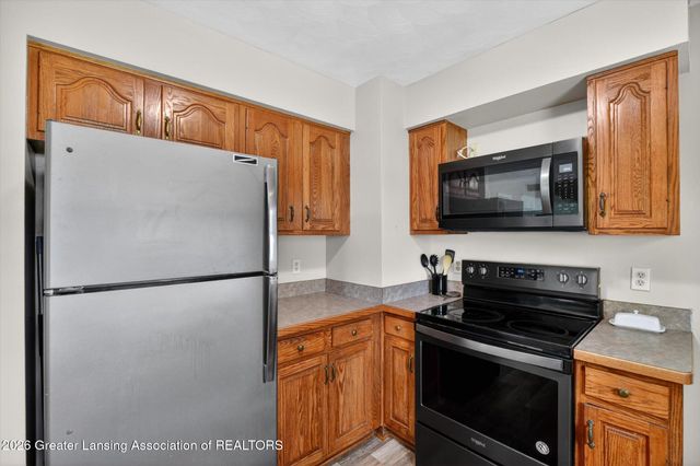 411 Green Meadows Drive, Lansing, MI 48917