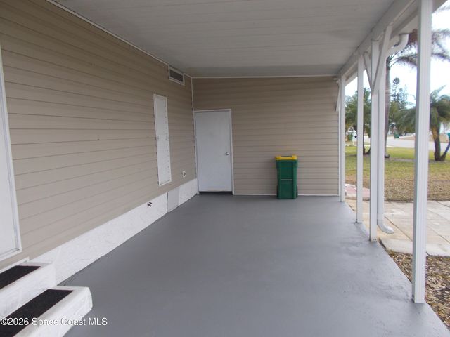 932 Cashew Circle W, Barefoot Bay, FL 32976