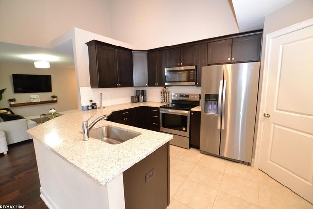 5656 Flagstaff Pines Drive 408, Shelby, MI 48317