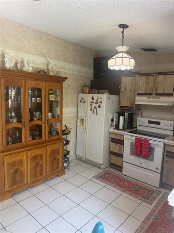 1304 DONWOODS LANE, Royal Palm Beach, FL 33411