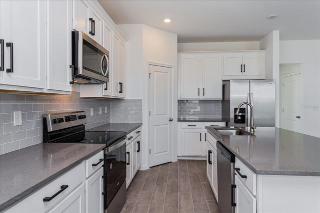 1010 SWAMP CHESTNUT LOOP, Lady Lake, FL 32159