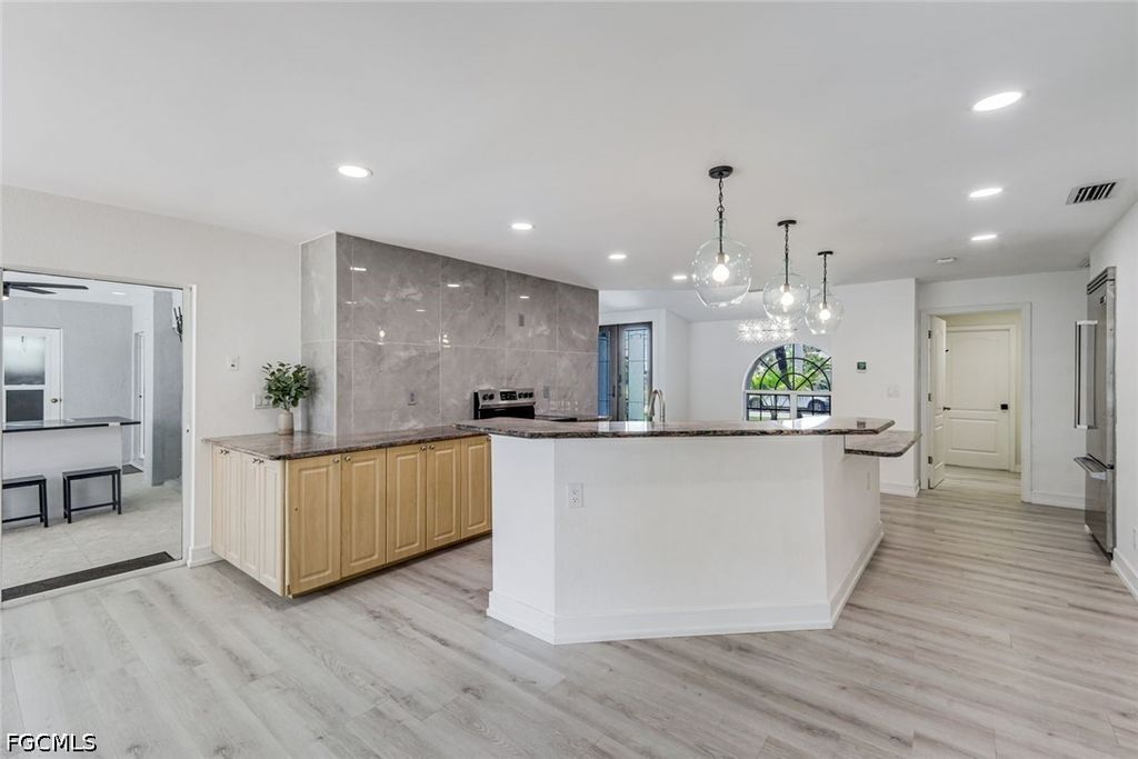 Image 10 of property listing at 1438 SW 57th ST, Cape Coral, FL 33914