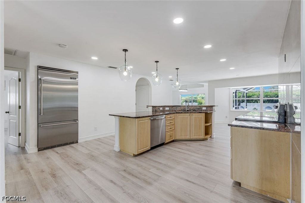 Image 8 of property listing at 1438 SW 57th ST, Cape Coral, FL 33914
