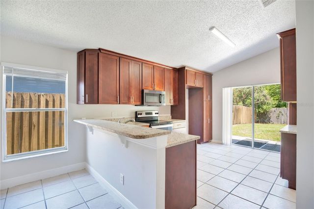10021 CYPRESS MEADOWS LANE, Orlando, FL 32825