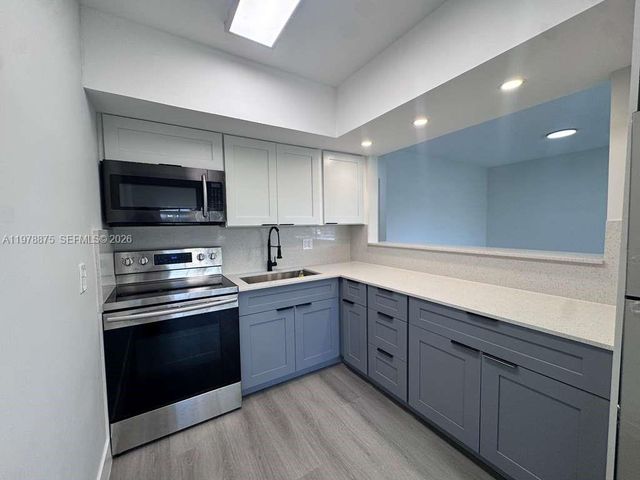 455 Golden Isles Dr 203, Hallandale Beach, FL 33009